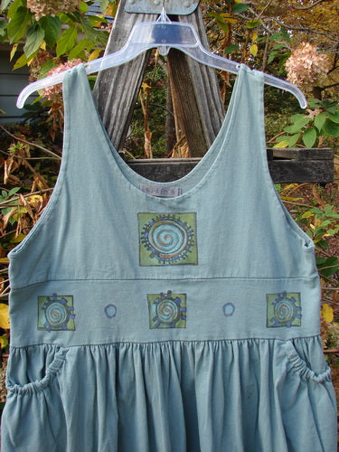 1996 Amusement Jumper Round Wind Trinket Size 1, featuring a ribbed hemline, elastic-accented pockets, and a detailed rounded wind theme paint, showcasing its vintage Blue Fish Clothing design from 1996.