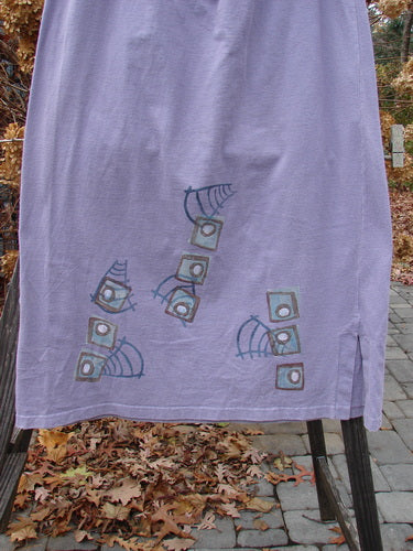 1996 Reprocessed Drawcord Skirt Primitive Mulberry Size 2, featuring a full drawcord waist, slightly widening rectangular shape, and 6-inch side vents, displayed with a modern faces design on heavy weight cotton.