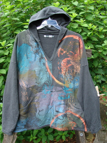 Barclay Cotton Hemp Roo Pocket Hoodie Pullover Metallic Path Black OSFA displayed outdoors; features a hood, kangaroo pocket, and A-line shape with domain shoulders, conveying cozy vintage Blue Fish Clothing style.