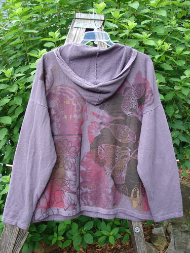 Barclay Cotton Hemp Roo Pocket Hoodie Pullover Rear Birdie Plum OSFA features a floral pattern, kangaroo pocket, generous A-line shape, domain shoulders, longer sleeves, and a cozy fleece hood.