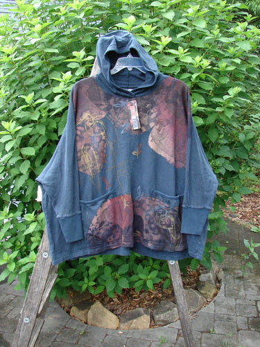 Barclay NWT Cotton Hemp Hooded Folklore Pullover Beach Bird Atlantic OSFA displayed on a swinger, showcasing its cordless hood, ribbed cuffs, wide flared swing, and dual painted pockets.