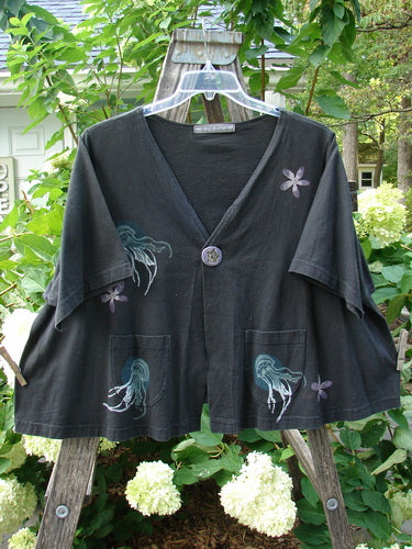 1997 Cove Jacket Sea Life Ebony Size 2 featuring a flared, cropped A-line shape with a V neckline, single handmade porcelain closure, and bright blue fish patch.