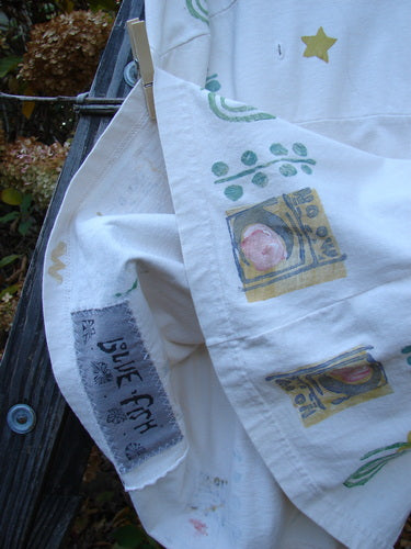 1992 Little Storma Dress Moon White OSFA featuring celestial moon-themed patches, deep rounded neckline, gathered top half rear with optional ribbon slits, and a drop lower rear waist panel.