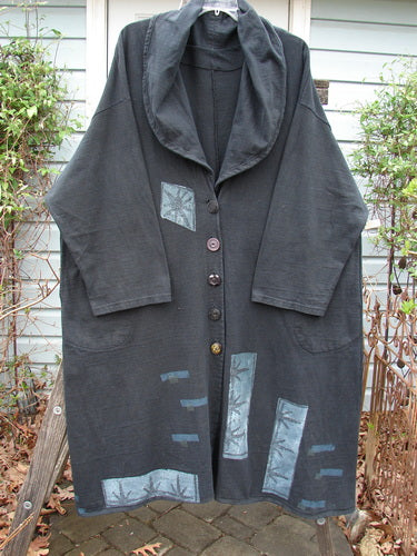 1994 Reprocessed Carriage Coat Forest Path Redyed Edo Black OSFA, featuring a patchwork design with oversized buttons, deep side pockets, and a versatile collar for a scarf or shawl effect.