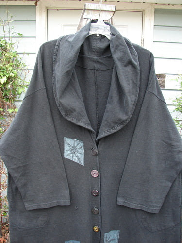 1994 Reprocessed Carriage Coat Forest Path Redyed Edo Black OSFA, featuring a wide billowy collar, oversized Blue Fish buttons, and a signature patch, showcasing vintage elegance and unique design.