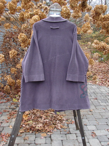2000 Patched Celtic Moss Highlander Coat Aubergine Size 0 on a rack, showcasing its plush dense fleece, empire waistline, unique horizontal and diagonal seams, large collar, and distinctive Blue Fish Signature patches.