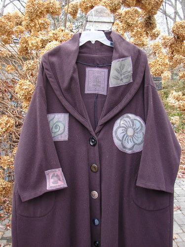 1994 Patched Wool Falling Snow Coat Plum Wine OSFA: Oversized, luxurious Melton wool coat with multi-colored patches, deep side pockets, huge shawl collar, vintage buttons, and a flared shape.