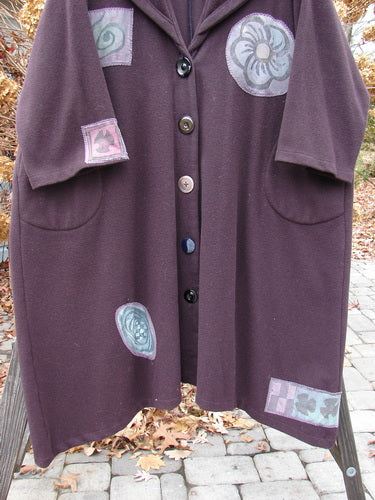 1994 Patched Wool Falling Snow Coat Plum Wine OSFA featuring multi-colored patches, oversized shawl collar, deep side pockets, and vintage buttons, offering a cozy, vintage-inspired look.