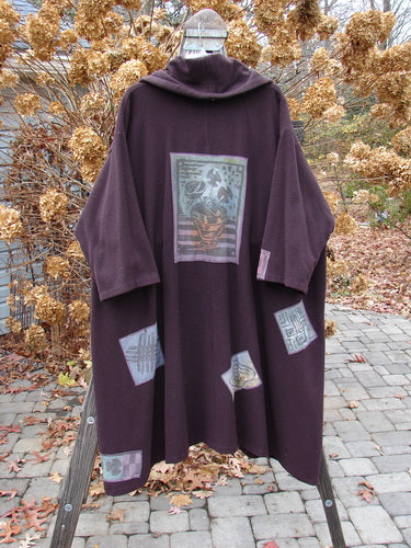 1994 Patched Wool Falling Snow Coat Plum Wine OSFA displayed on a wooden stand, featuring a hood and colorful patches.