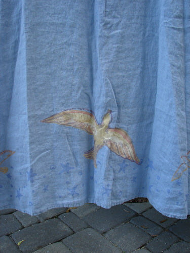 1999 Handkerchief Linen Sunbeam Dress Love Dove Water Altered Size 1, featuring a blue fabric with a bird motif, a curved empire waist, and a flared lower bodice.