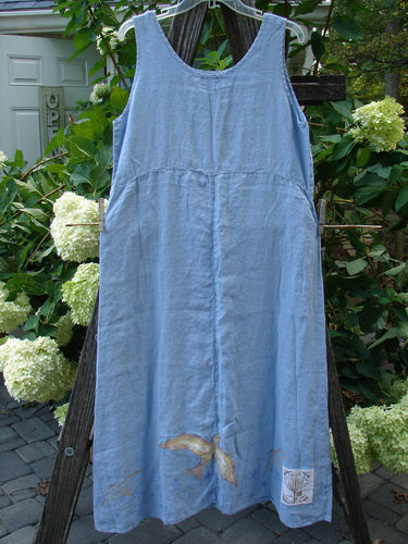 1999 Handkerchief Linen Sunbeam Dress Love Dove Water Altered Size 1 displayed on a clothes rack, showcasing its lightweight fabric, downward curved empire waist, and flared lower bodice.