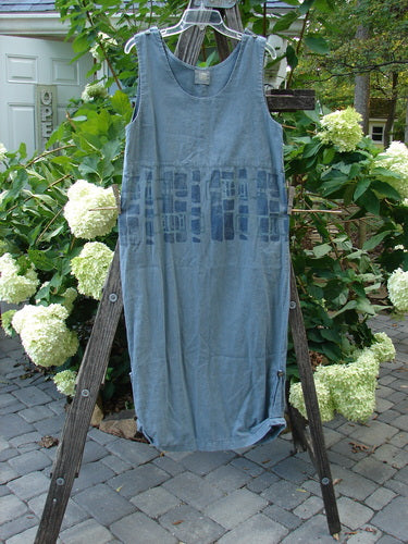 2000 Almost Seven Jumper Stone Path Blue Mineral Altered Size 1 displayed on a wooden rack, showcasing button shoulders, a rounded neckline, and unique tabbed sides at the hem.
