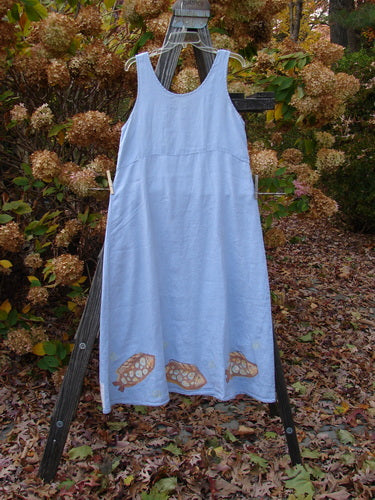 2000 Summer Shift Dress Fish Stream Size 1 on a clothes rack; features flowing linen fabric, empire waist, flared lower, bright hem paint with a fish theme, and single vertical back seam.