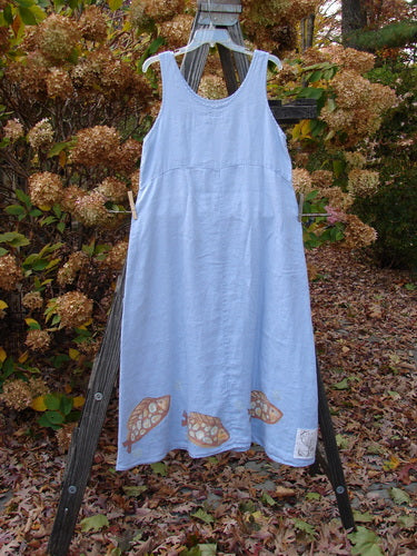 2000 Summer Shift Dress Fish Stream Size 1: A light blue dress with a flowing fabric, empire waist seam, and flared lower. Features a spotted fish theme on the lower hem with a signature Patch