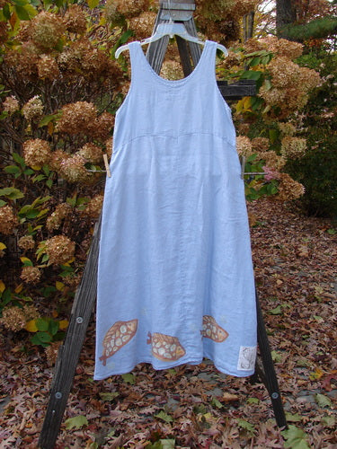 2000 Summer Shift Dress Fish Stream Size 1 on a wooden ladder, featuring a curved empire waist, flowing linen fabric, and a bright lower hem with a spotted fish theme.