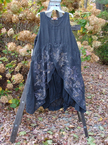 Barclay Linen Open Front Drawcord Hem Jumper featuring a layered crossover front and elastic gathered hem, displayed on a wooden stand.