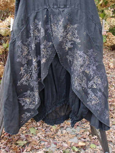 Barclay Linen Open Front Drawcord Hem Jumper Metallic Floral Black Size 1, showcasing a black skirt with a floral design, layered cross-over front, and elastic gathered hemline.