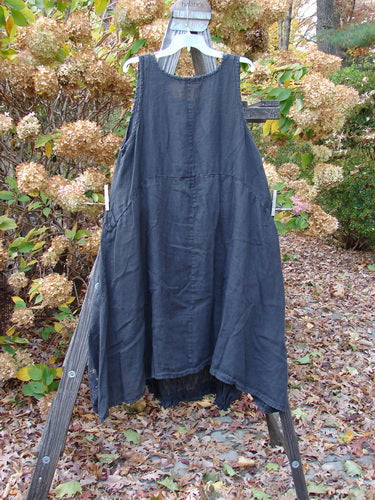 Barclay Linen Open Front Drawcord Hem Jumper Metallic Floral Black Size 1 displayed on a wooden ladder, showcasing its layered crossover front and elastic gathered hemline.