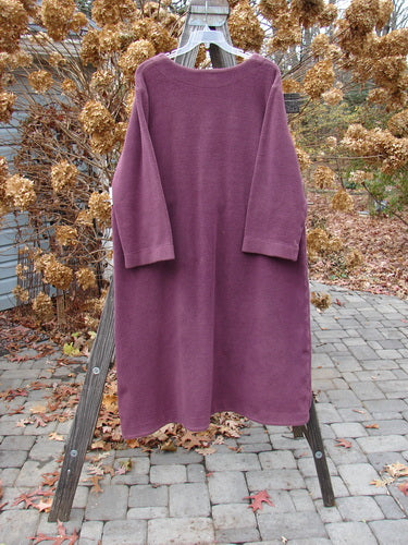 2000 Celtic Moss Hobo Coat Unpainted Murple Size 1 displayed on a wooden stand, showcasing its deep V neckline, plush dense material, and belled sleeves with metal-like buttons.