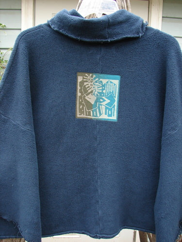 Barclay Patched Celtic Moss Crop Cowl Neck Pullover Navy OSFA featuring a soft, dense texture, floppy cowl neck, dolman sleeves, and side vented hem, showcasing Bluefishfinder's unique vintage style.