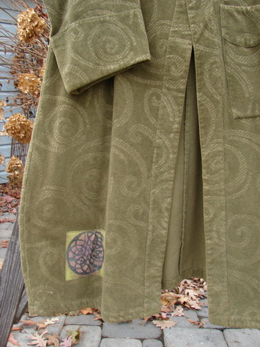 2000 Patched Upholstery Diwmach Coat Swirl Pine Size 2; luxurious tapestry cotton coat with colorful patches, large pocket, scalloped neckline, vintage buttons, belled sleeves, and pleated back.