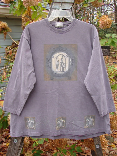 1999 Long Sleeved Tee Candle Blackberry Size 1 features a detailed drawing of candles in a window, capturing a vintage aesthetic. The design aligns with Bluefishfinder.com's unique, expressive clothing collection.