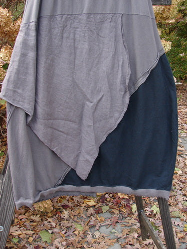 Barclay Mixed Media Swatch Skirt Unpainted Black Plum Size 2 displayed on an outdoor rack, showcasing multiple directional swatches with varied textures and a full elastic waistline.