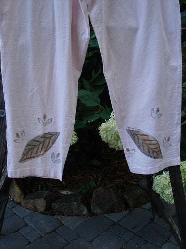 1999 Simple Vent Pant Fallen Leaf Orchid Size 1, featuring leaf-themed paint, full elastic waistline, lower ankle vents, and two inseam side pockets, made from organic mid-weight cotton.