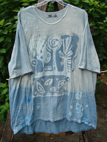 Barclay Tournesol Tunic Flower Power Mottled Day Sky OSFA featuring a longer tunic length, loose three-quarter sleeves, and a unique varying hemline.
