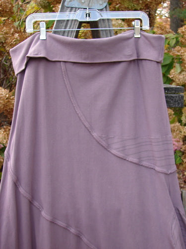 Barclay Cotton Lycra Fold Over Lantern Skirt Stripe Plum Size 2 hanging on a clothesline, showcasing its unique fold-over waistline, bell shape, and detailed exterior stitchery.