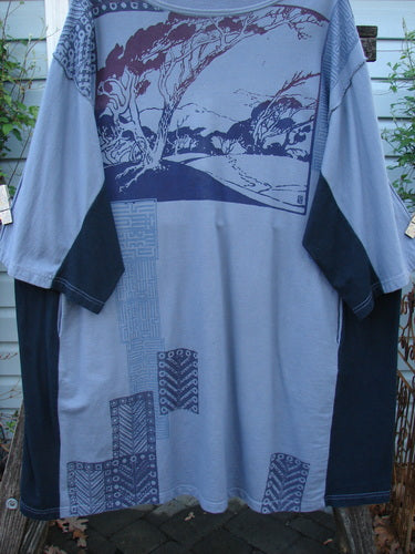 Barclay Cotton Interlock Contrast Side Panel Tunic Scenic Travel Sky Black Size 2 features a distinct A-line shape, wide sleeves, and scenic travel-themed design, highlighting its artistic and vintage-inspired style.