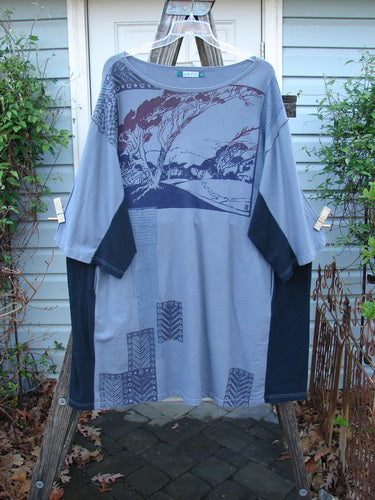 Barclay Cotton Interlock Contrast Side Panel Tunic Scenic Travel Sky Black Size 2 displayed on a hanger, featuring a slightly belled A-line shape, wide sleeves, and deep inseam side pockets.