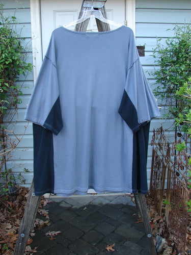 Barclay Cotton Interlock Contrast Side Panel Tunic features a boatneck, three-quarter sleeves, and contrasting side panels, displayed on a clothes rack. Part of Bluefishfinder's vintage-inspired collection.