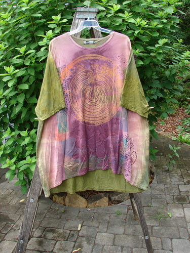 Close-up of the Barclay Art Tee Primitive Path Mottled Fall Festival OSFA, showcasing its longer tunic length, drop shoulders, loose three-quarter sleeves, rounded neckline, and upward rounded front hem.