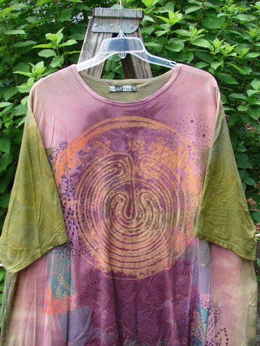 Barclay Art Tee Primitive Path Mottled Fall Festival OSFA: Close-up of a medium-weight organic cotton shirt, featuring a tunic length, drop shoulders, loose three-quarter sleeves, and upward rounded front hem on a swinger.
