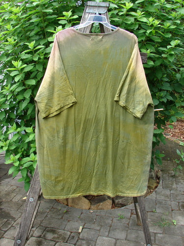 Barclay Art Tee Primitive Path Mottled Fall Festival OSFA displayed on a wooden stand, showcasing its tunic length, drop shoulders, three-quarter sleeves, and varying hemline, embodying BlueFishFinder's unique, expressive style.