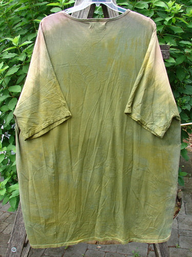 Barclay Art Tee Primitive Path Mottled Fall Festival OSFA displayed on a rack, featuring a longer tunic length, drop shoulders, loose three-quarter sleeves, rounded neckline, and upward rounded front hem.