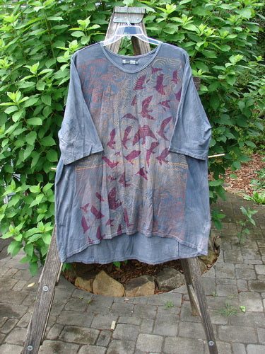 Barclay Tournesol Tunic Gull Flock Mottled Night Sky OSFA displayed on a wooden stand, highlighting its loose three-quarter sleeves, rounded neckline, varying hemline, and bird motif design.