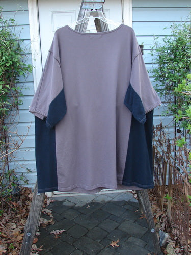 Barclay Cotton Interlock Contrast Side Panel Tunic, featuring three-quarter wide sleeves and contour floral theme, displayed on a clothes rack.