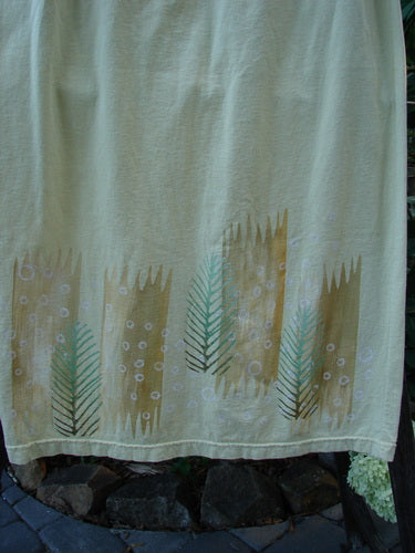 2000 Straight Skirt Pine Forest Plantain Size 1: A white organic cotton skirt with green leaf patterns, featuring a full elastic waistband and a slight A-line shape, from the Summer Collection of 2000.