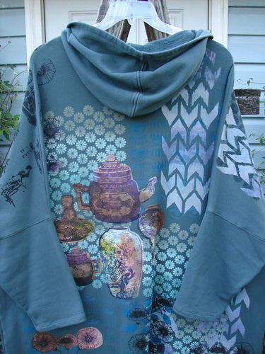 Barclay Fleece Hooded Zip Pocket Jacket Equestrian Light Love Mirror Size 3, featuring a unique teapot pattern, cozy hood, and kangaroo pockets, reflecting vintage Blue Fish Clothing's creative and individual style.