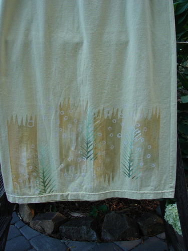 2000 Straight Skirt Pine Forest Plantain Size 1 on a clothesline, showcasing the hem's pine forest theme and slight A-line shape with a full elastic waistband.