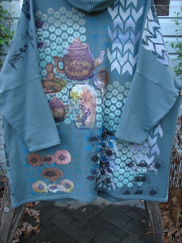 Barclay Fleece Hooded Zip Pocket Jacket Equestrian Light Love Mirror Size 3 featuring a teapot and floral pattern, cozy hood, kangaroo pockets, and dolman shoulders, embodying vintage Blue Fish Clothing's creative style.