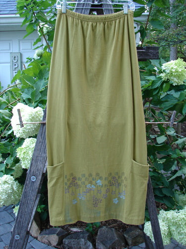 2000 Leaflet Skirt Garden Peapod Altered Size 0, featuring a billowy wrap-around design, tapered hemline, and colorful garden theme. Full elastic waistband, lower drop pockets. Organic cotton, Spring Collection 2000.