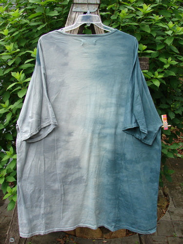 Barclay Art Tee Bud Rise Mottled Green Storm OSFA displayed on a swinger, highlighting its tunic length, drop shoulders, and loose three-quarter sleeves, embodying Bluefishfinder.com's vintage-inspired, creative clothing ethos.