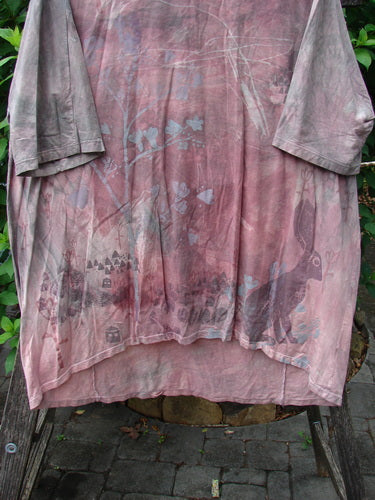 Barclay Tournesol Tunic Bunny Field Mottled Mauve OSFA features a mid-length design with drop shoulders and three-quarter sleeves, showcasing its unique hemline and bunny-themed paint in a close-up view.