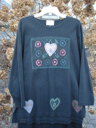 1999 Vented Straight Duo Heart Black Size 1: A long-sleeved shirt with a heart design, featuring a rolled neckline, vented sides, and a unique mosaic heart theme paint. Paired with a matching straight skirt with colorful mosaic hearts. Made from organic cotton.