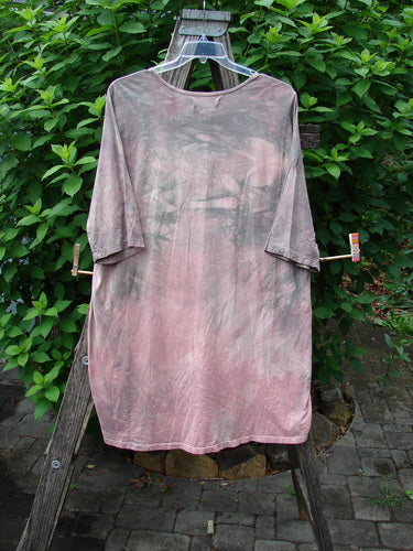 Barclay Tournesol Tunic Bunny Field Mottled Mauve OSFA showcased on a wooden stand, highlighting its longer tunic length, drop shoulders, and loose three-quarter sleeves, embodying BlueFishFinder's vintage style.