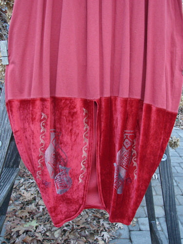 1996 Velvet Arrowhead Sofia Duo Pomegranate Size 1 featuring a red and pink skirt with a distinct pattern, displayed to showcase its bell-shaped upper and pegged lower shape.