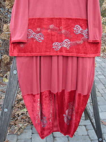 1996 Velvet Arrowhead Sofia Duo Pomegranate Size 1 displayed on a ladder, showcasing the pullover's V-neckline and velvet accents, paired with the matching bell-shaped skirt featuring a pegged lower shape.